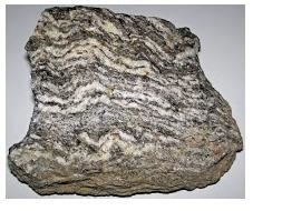 Is This An Igneous Rock Or Metamorphic Or Sedimentary?-example-1