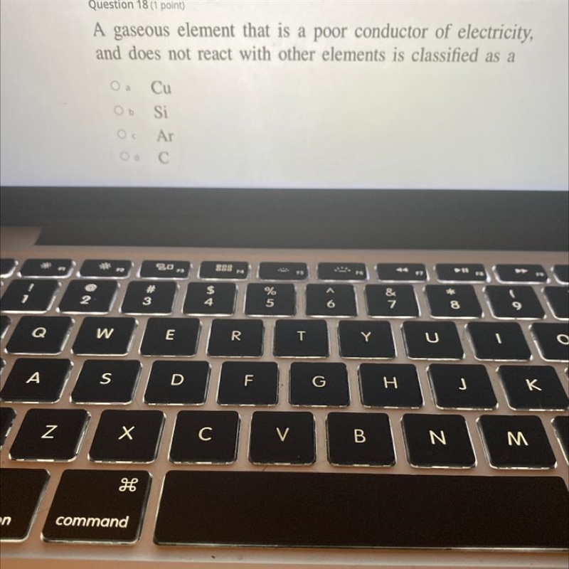 A gaseous element that is a poor conductor of electricity, and does not react with-example-1