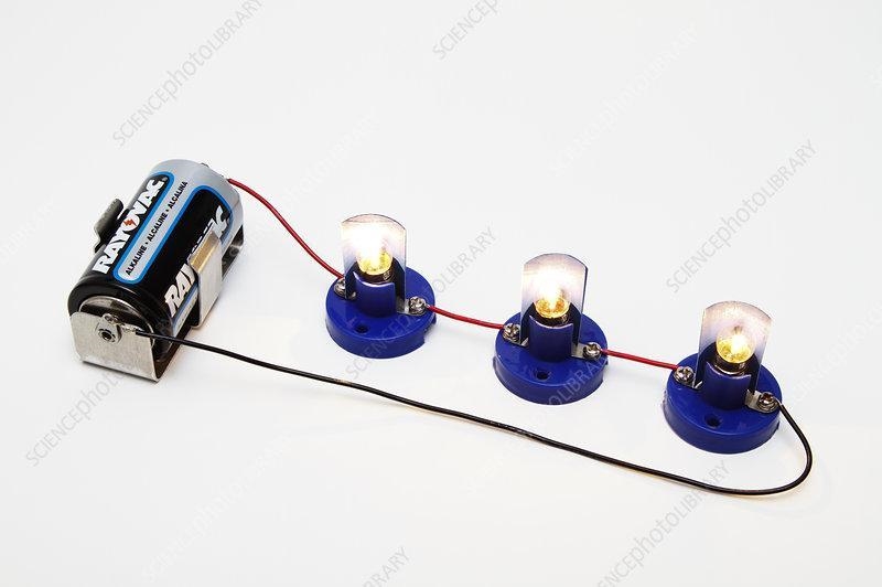 What type of circuit is seen in the picture? 3 light bulbs and a battery connected-example-1