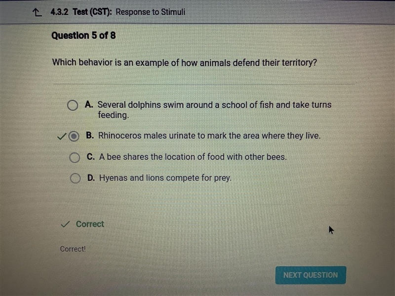 Which behavior is an example of how animals defend their territory? O A. Rhinoceros-example-1