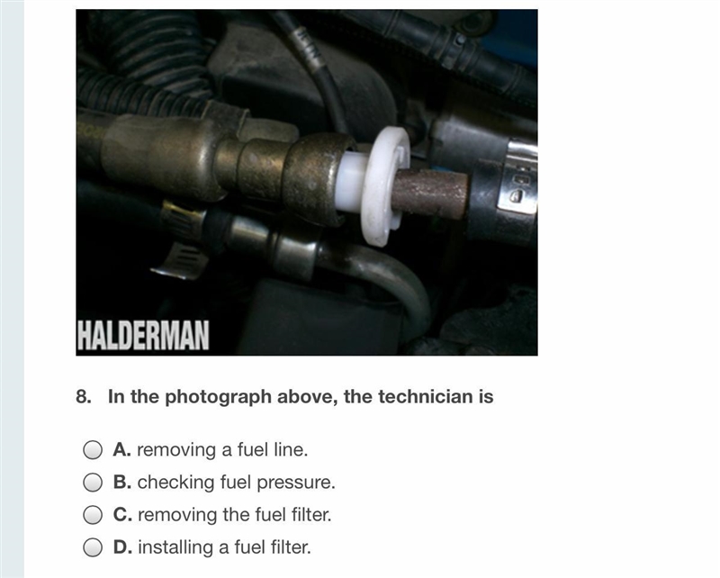 In the photograph above, the technician is doing what?-example-1