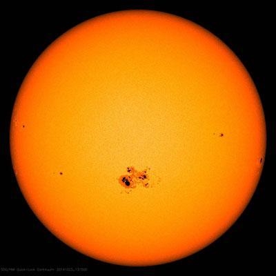 Which dark solar feature is shown in the picture above? Solar flare Prominence Sunspot-example-1