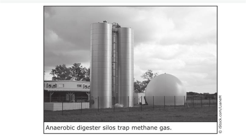 What does the photograph of the anaerobic digester silos and its caption help the-example-1