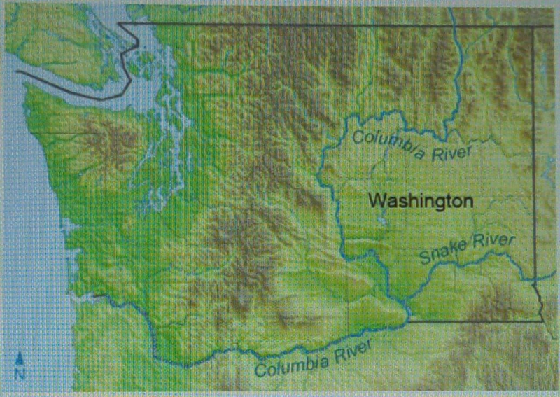 What physical feature lies just north of where the Snake and Columbia Rivers meet-example-1