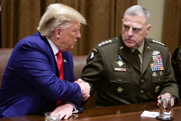 Four star general Mark Milley shown here is sitting with the commander in chief of-example-1