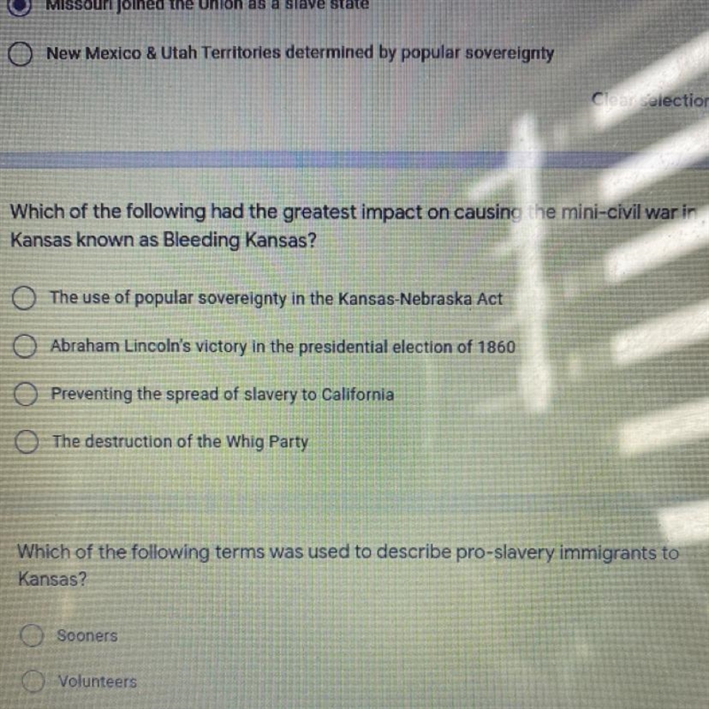 Which of the following had the greatest impact on causing the mini-civil war in Kansas-example-1