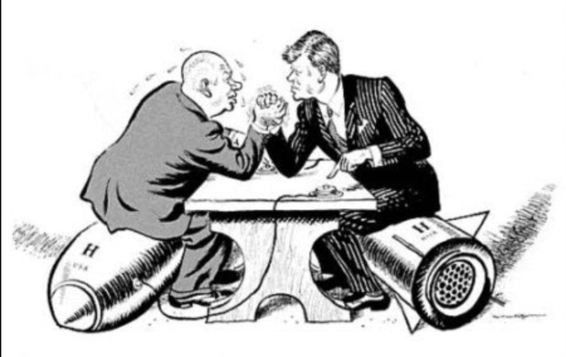 This is a picture of / cartoon depicting Kennedy and Khrushchev during the Cold War-example-1