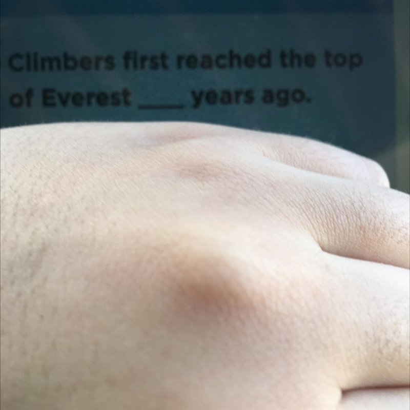 How many years ago was when the first climber reached the top of everest-example-1