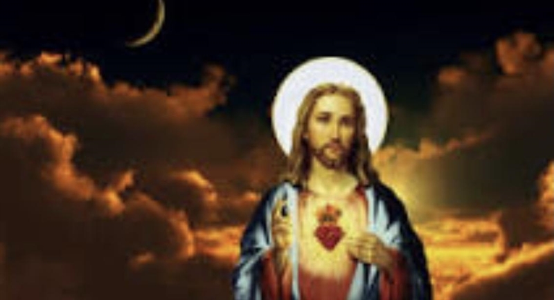 What is Jesus holding? (Sorry it’s blurry)-example-1