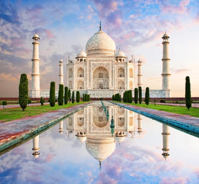 What is the Taj Mahal? Explain who had it built and for what purpose.-example-1