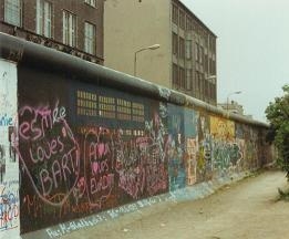 The photo shows the Berlin Wall in Germany. The Soviet Union built this symbol of-example-1