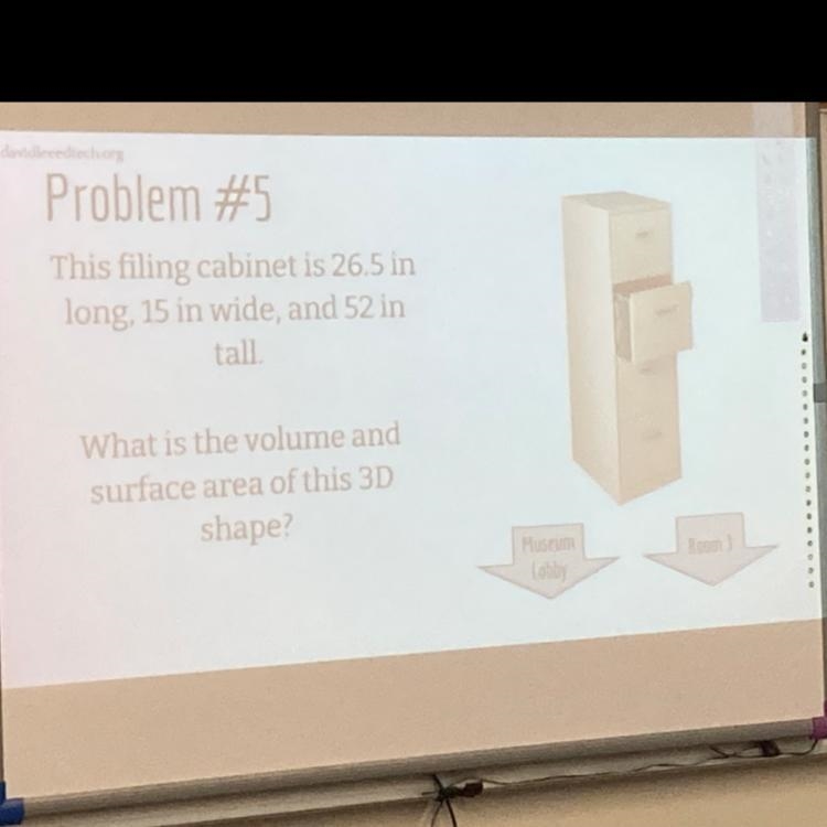 This filling cabinet is 26.5 in long. 15 in wide, and 52 in tall. What is the volume-example-1