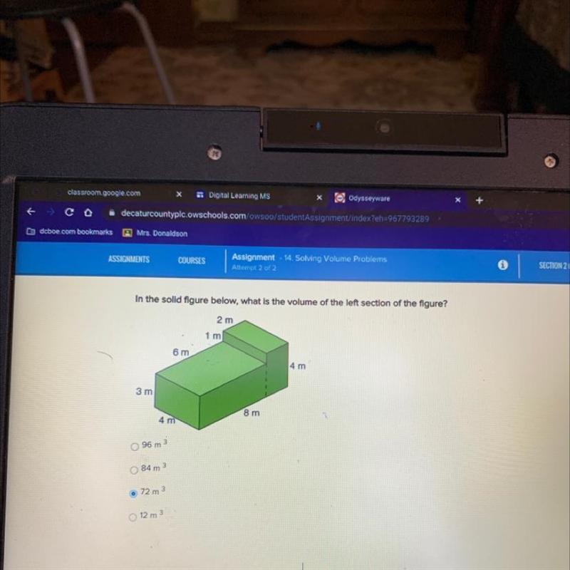 In the solid figure below, what is the volume of the left section of the figure? 2 m-example-1