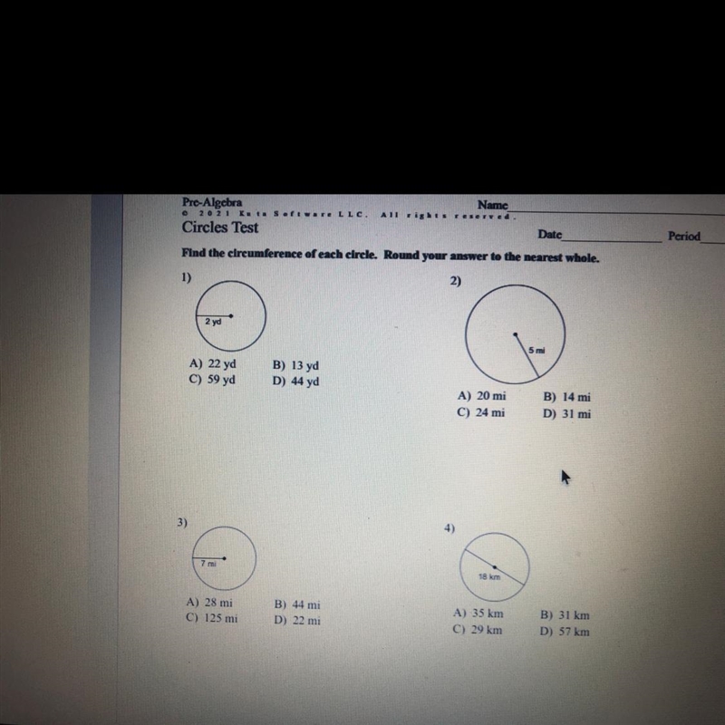 Circles Test Find the circumference of each circle. Round your answer to the nearest-example-1