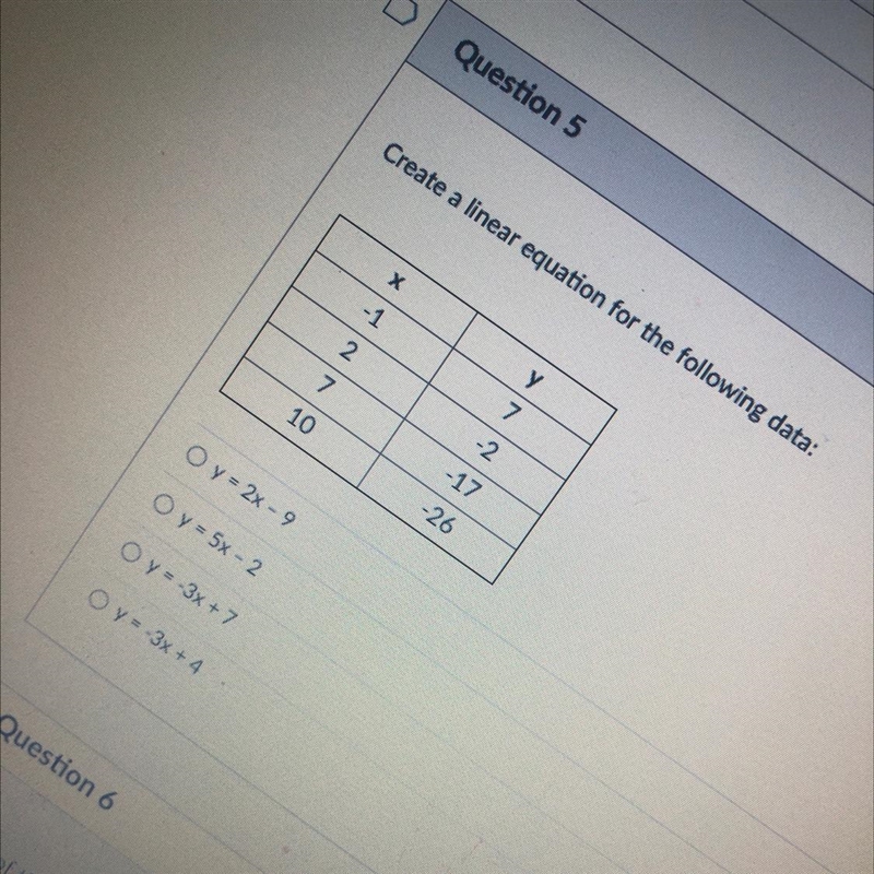 Create a linear equation for the following data: Х у -1 7 2 -2 7. -17 10 -26 O y = 2x-example-1