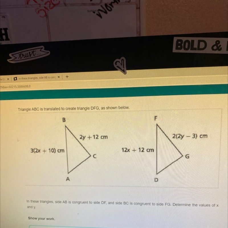 Triangle ABC is translated to create triangle DFG, as shown below. 2y + 12 cm 212y-example-1