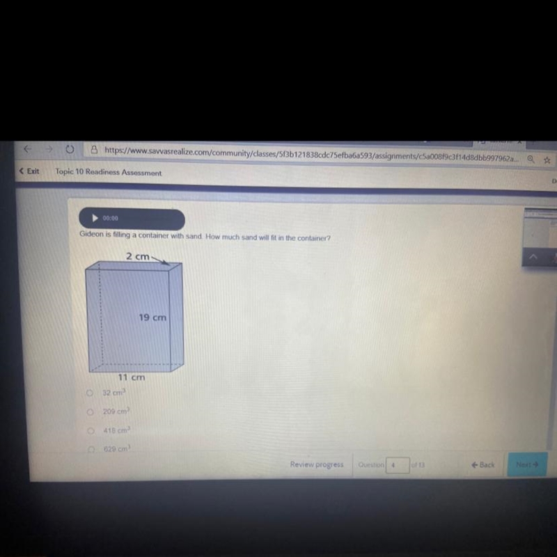 Gideon is filling a container with sand. How much sand will fit in the container-example-1