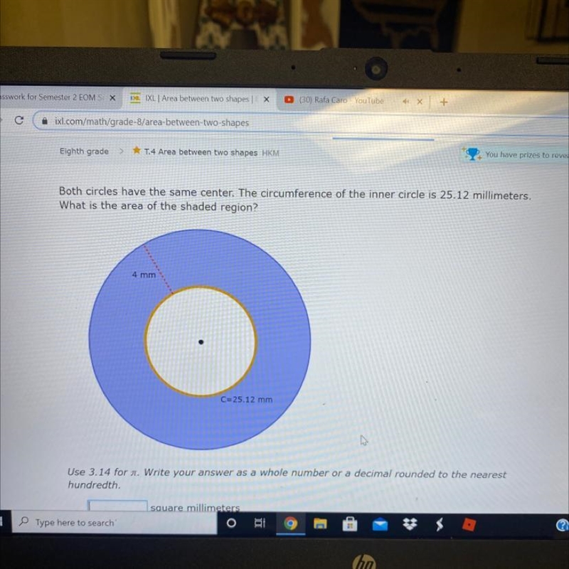 Both circles have the same center. The circumference of the inner circle is 25.12 millimeters-example-1