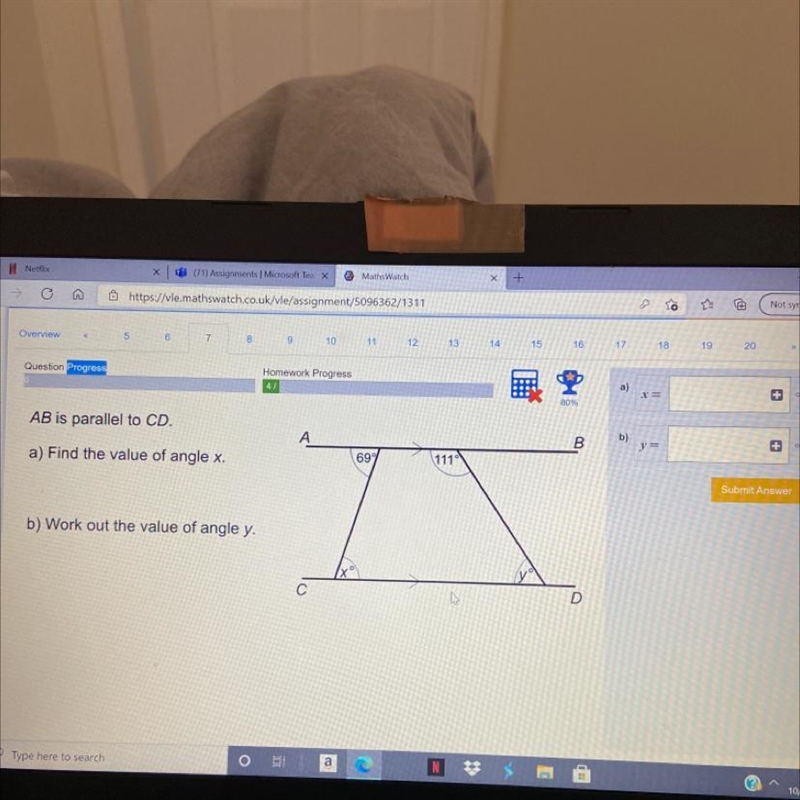 AB is parallel to CD. А E 697 111 a) Find the value of angle x. b) Work out the value-example-1