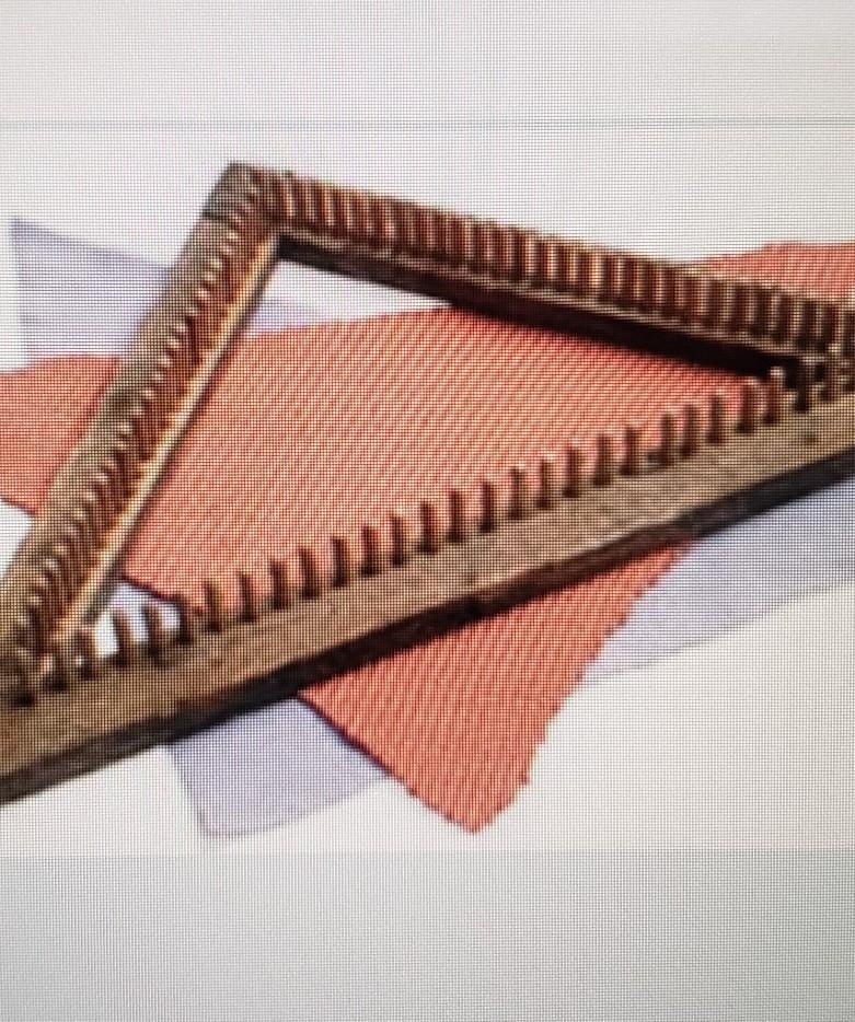 the triangle Loom is made from wood strips shaped into a 45 45 90 triangle. pegs are-example-1