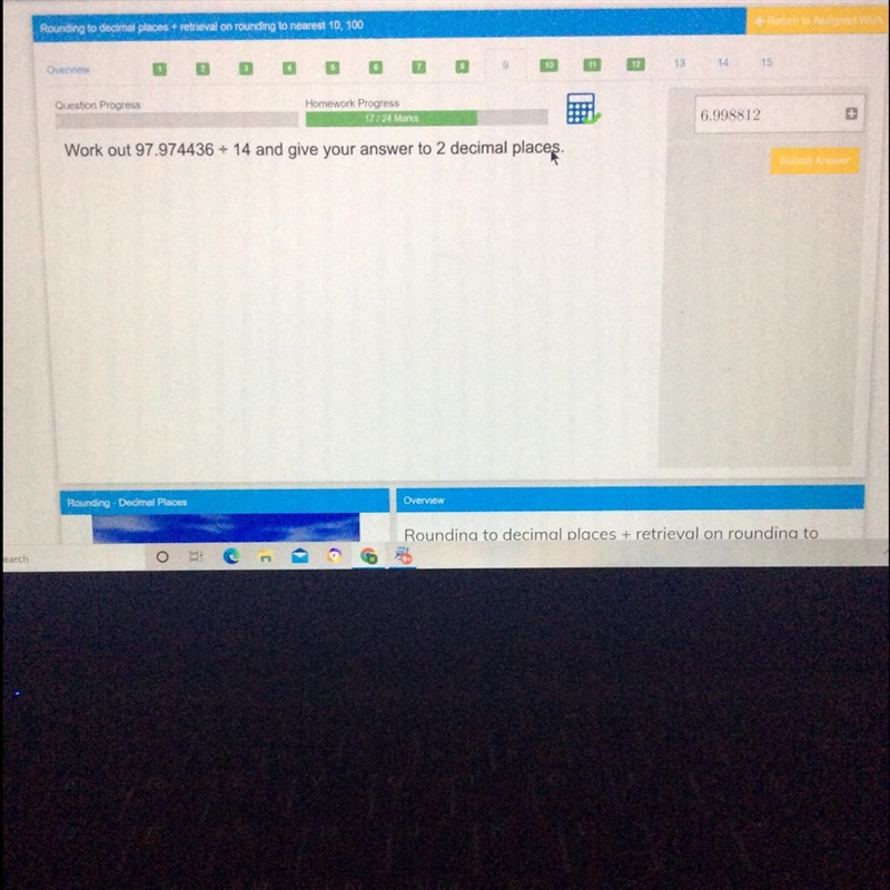 Work out 97.974436 divide 14 and give your answer to 2 decimal places.-example-1