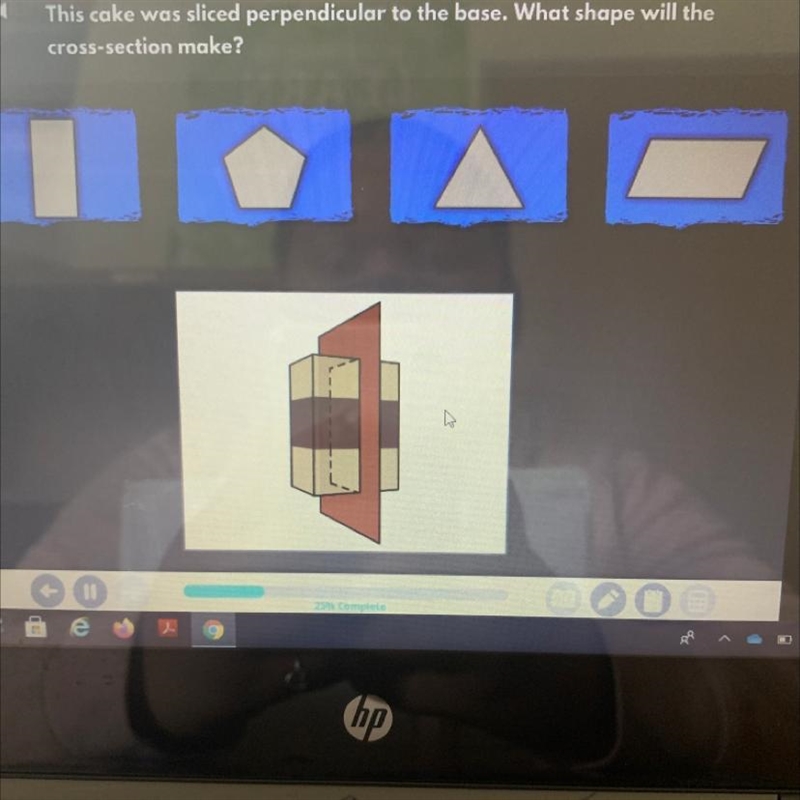 This cake was sliced perpendicular to the base. What shape will the cross-section-example-1