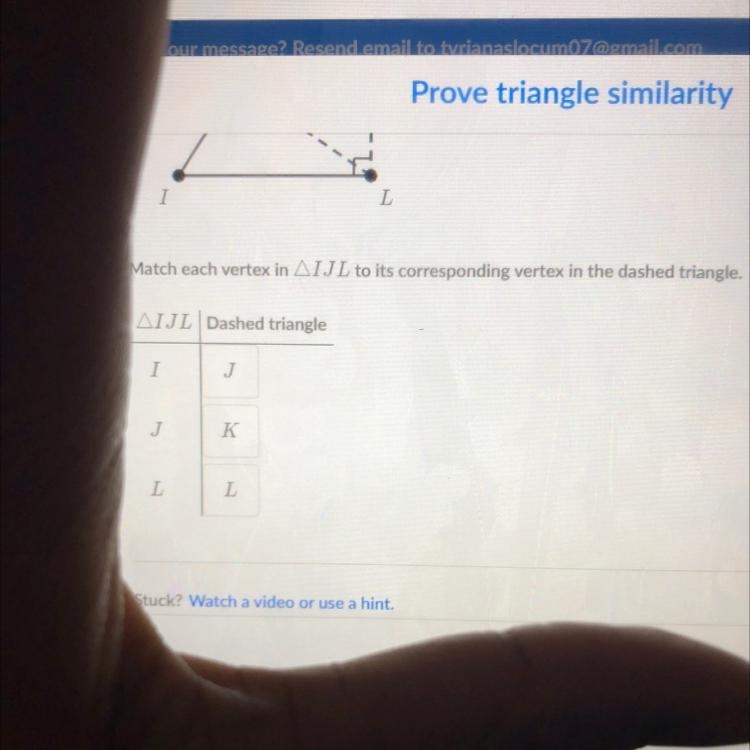 Match each vertex in IJL to its corresponding vertex in the dashed triangle.-example-1
