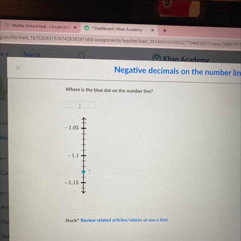 Where is the blue dot on the number line? -1.05 -1.1 -1.15-example-1