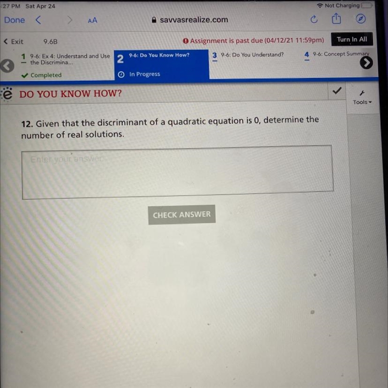 Given that the discriminant of a quadratic equation is 0, determine the number of-example-1