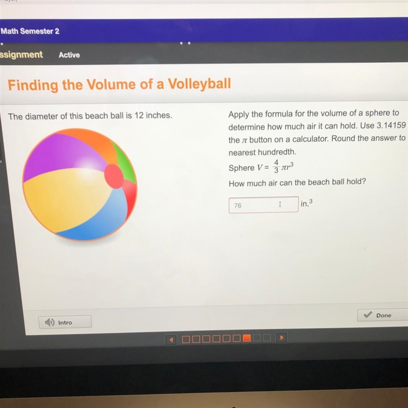 The diameter of this beach ball is 12 inches. Apply the formula for the volume of-example-1