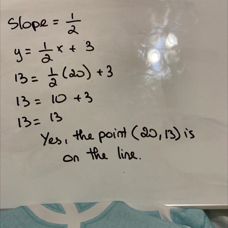 2. Write an equation for the line, in slope intercept form. Then answer, is the point-example-1