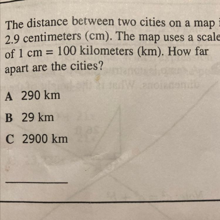 The distance between two cities on a map is 2.9 centimeters (cm). The map uses a scale-example-1