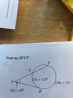 Using a secant and a tangent, find angle WVT.-example-1