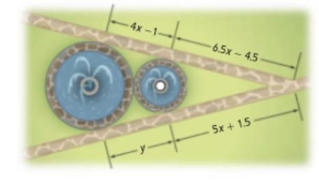 A landscape architect is designing a public patch with two adjacent circular fountains-example-1