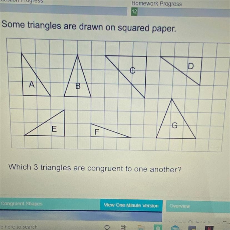 Some triangles are drawn on squared paper. Which 3 triangles are congruent to one-example-1