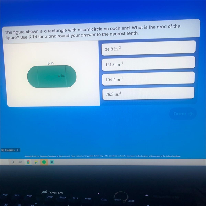 The figure shown is a rectangle with a semicircle on each end. What is the area of-example-1