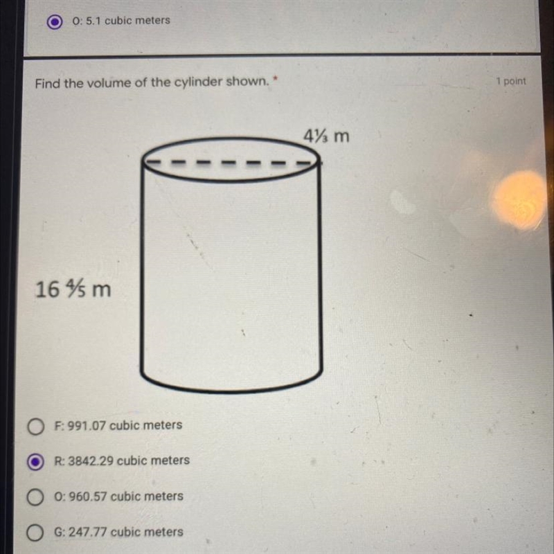 Find the volume of the cylinder shown. 1 point 4% m - - 164 m F: 991.07 cubic meters-example-1