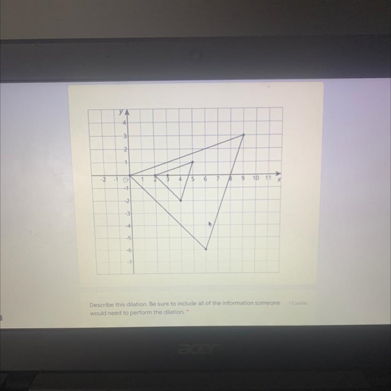 The smaller triangle is dilated to create the larger triangle. The center of dilation-example-1