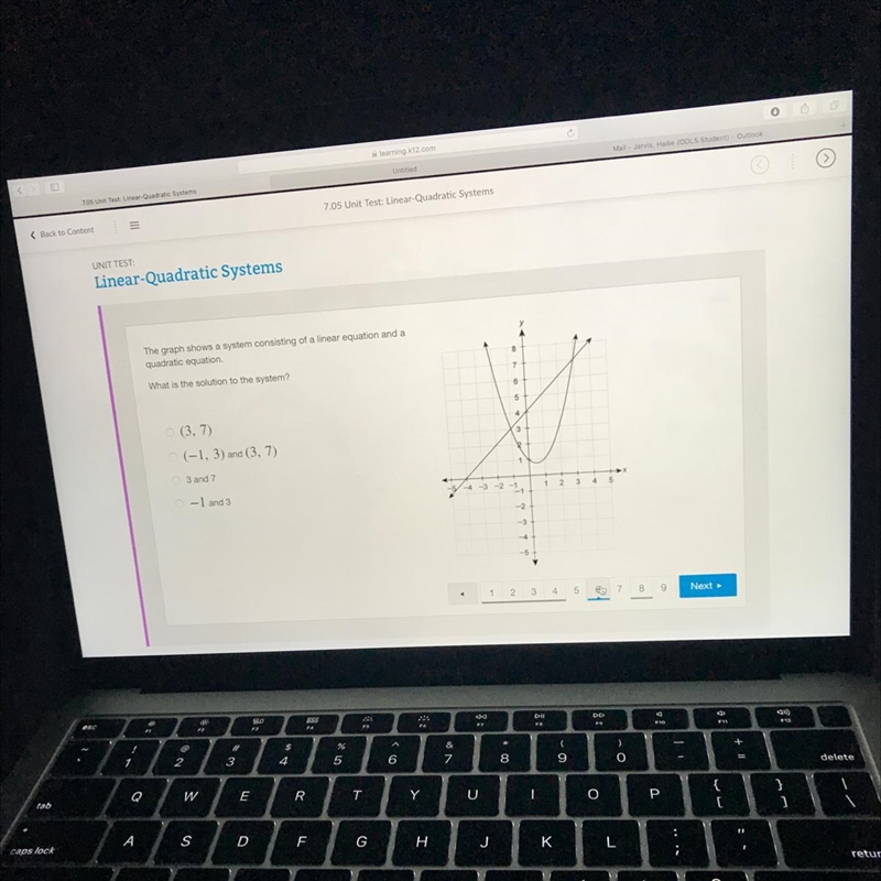 The graph shows a system consisting of a linear equation and a quadratic equation-example-1