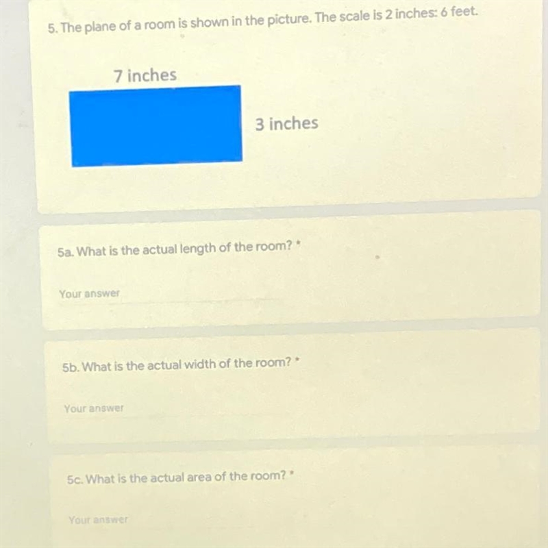 The plane of a room is shown in the picture. the scale is 2 inches: 6 feet. what is-example-1