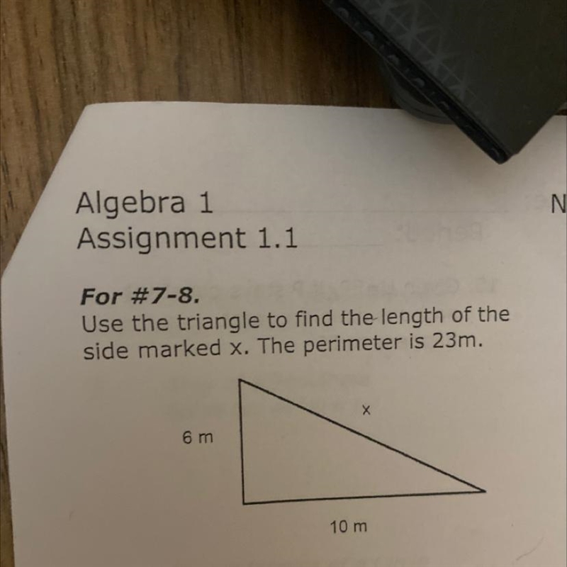 Use the triangle to find the length of the side marked x. The perimeter is 23m. X-example-1