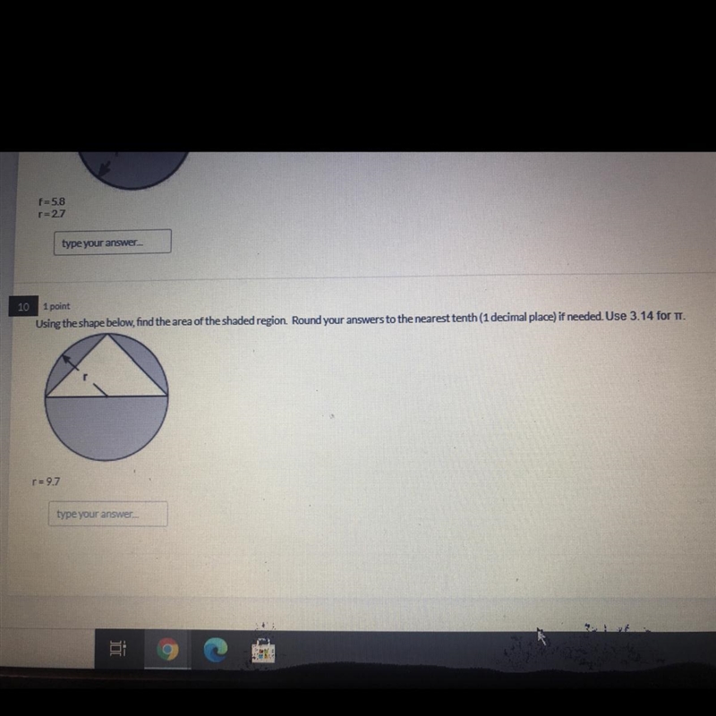 Using the shape below, find the area of the shaded region. Round your answers to the-example-1