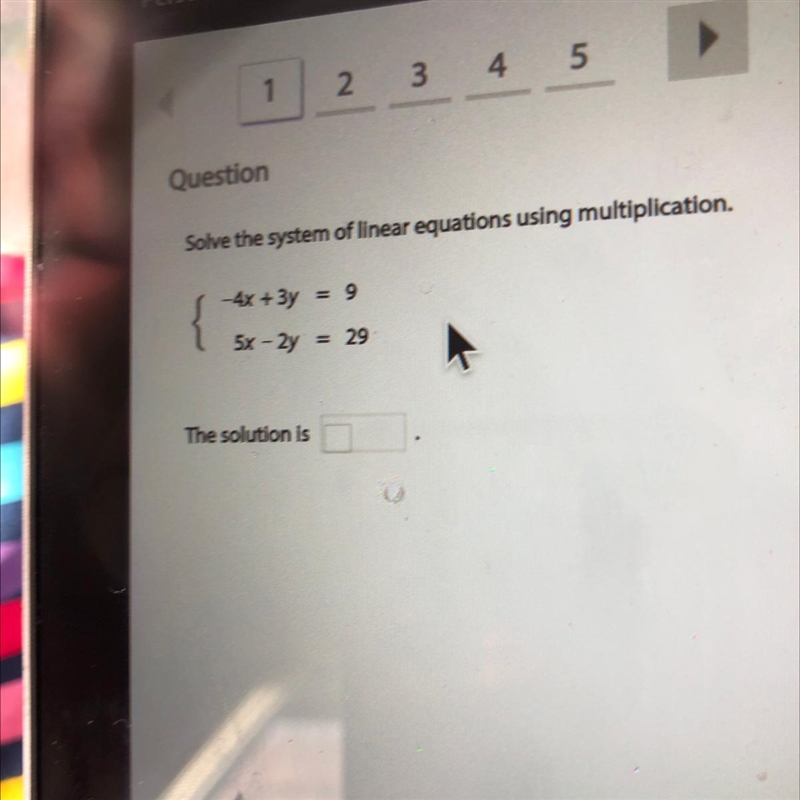 Solve the system of linear equations using multiplication. - 4x + 3y 9 5x - 2y 29 The-example-1