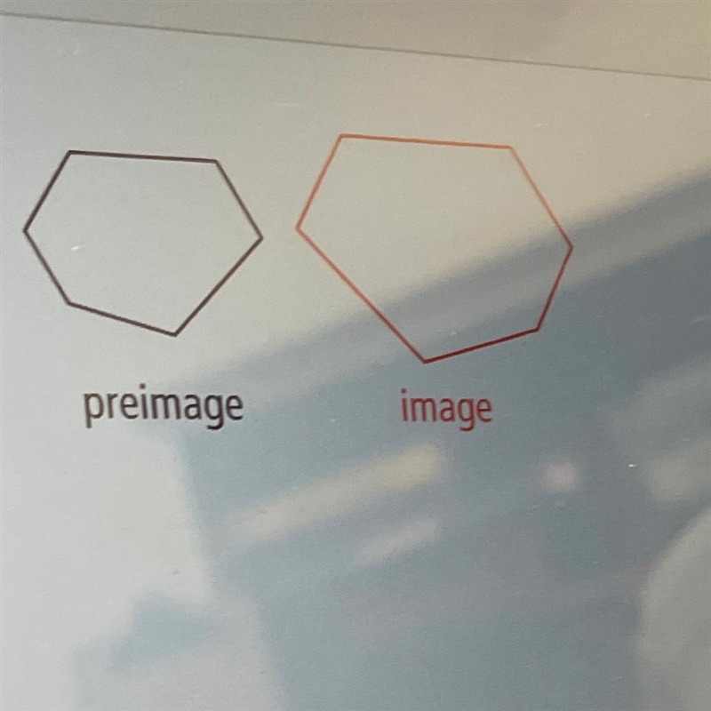 Does the transformation shown appear to be a rigid motion? Explain-example-1