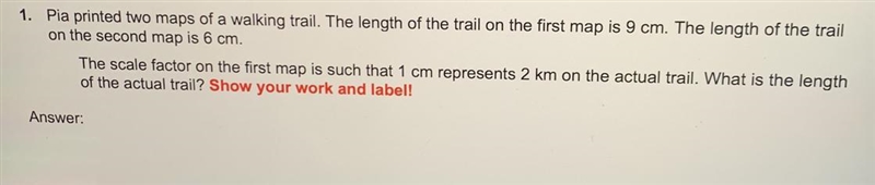 HELP!!! Pia printed two maps of a walking trail. The length of the trail on the first-example-1