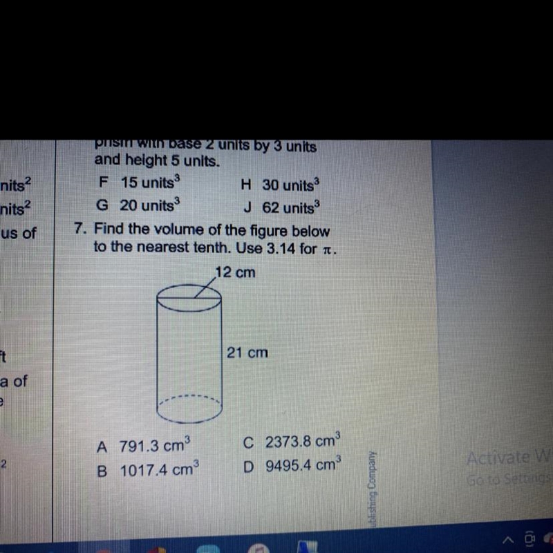 Find the volume of the figure below to the nearest tenth. use 3.14-example-1