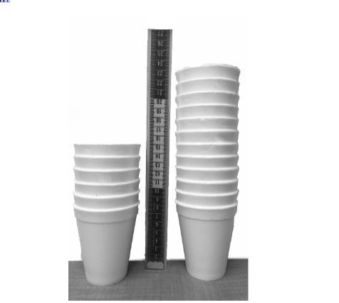 HELP We have two stacks of styrofoam cups. One stack has 6 cups, and its height is-example-1