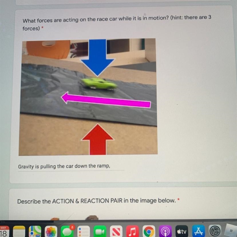 What forces are acting on the race car while it is in motion? (hint: there are 3 forces-example-1