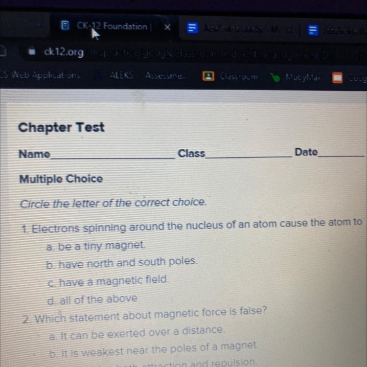 1. Electrons spinning around the nucleus of an atom cause the atom to a. be a tiny-example-1