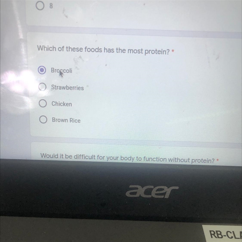 Which of these foods has the most protein? Broccoli Strawberries Chicken Brown Rice-example-1